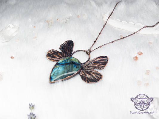 Blue and green labradorite set with electroformed butterfly wings