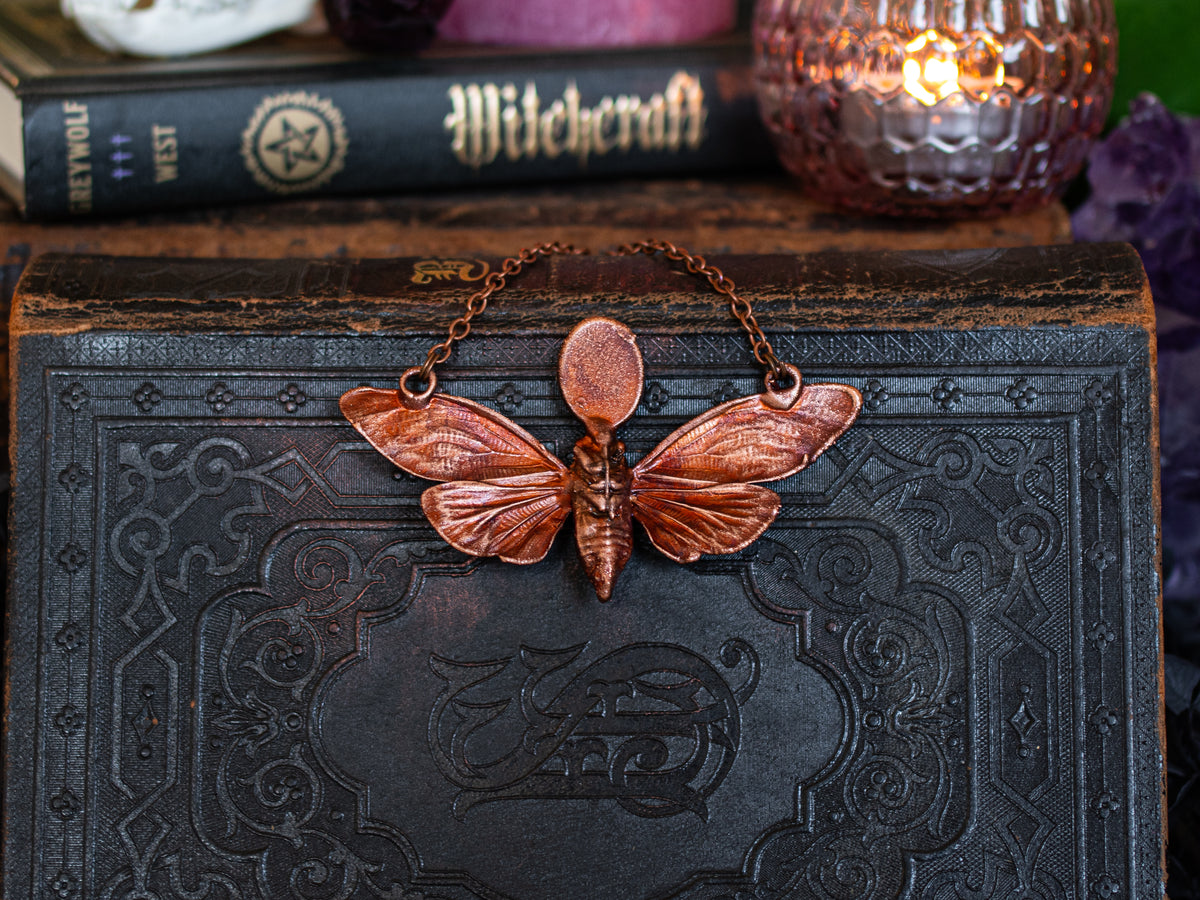 Dark vintage copper cicada pendant with three gemstone types
