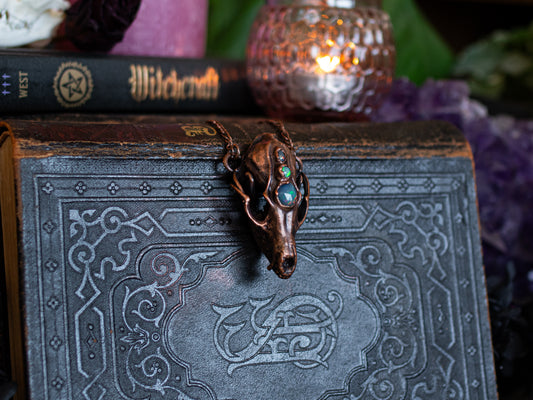 Fox skull pendant with three hand-faceted Ethiopian opals in copper