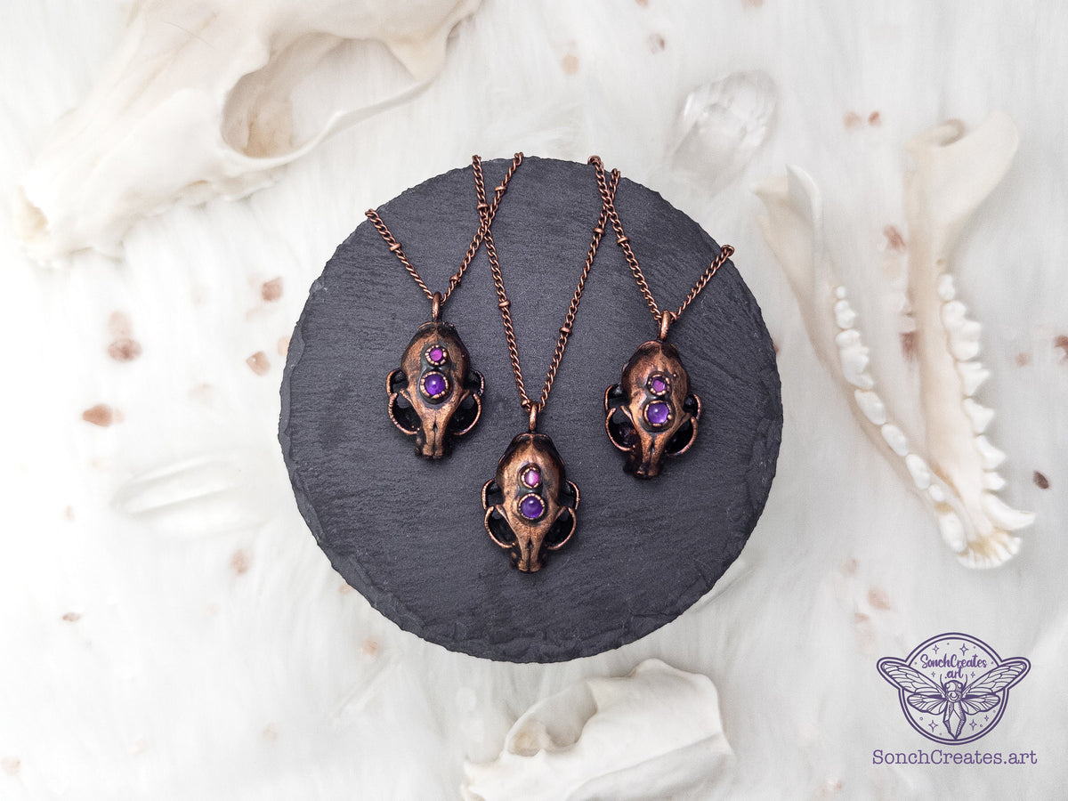 Electroformed resin cat skull necklace with two gemstones